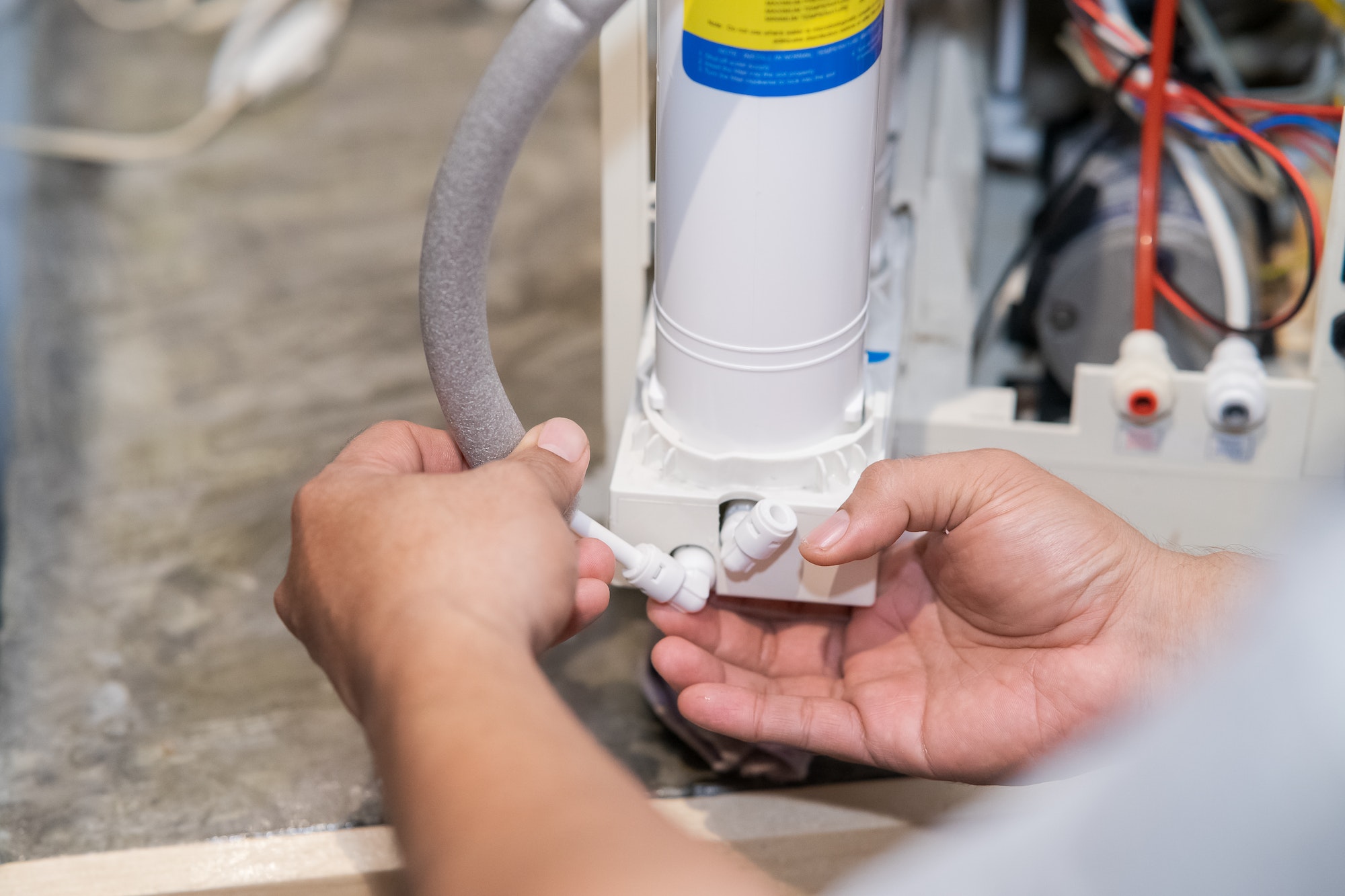 Changing water filter at home.